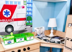 Medical supplies for the preschool hospital center, featuring toy bloods pressure cuffs, reflex hammers, thermometers, and x-ray photographs.