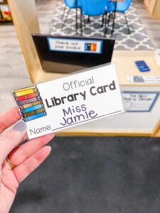 Preschool library dramatic play center - hand holding a library card