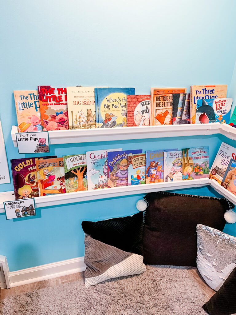 Preschool library dramatic play center - books on shelves with pillows on ground