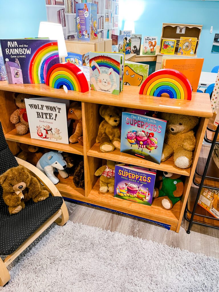Preschool library dramatic play center - shelves with books and comfortable seating