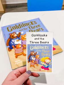preschool library dramatic play center showing book and library card