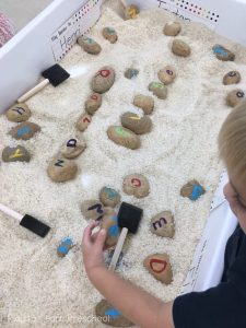 SENSORY play rice letter rocks in rice