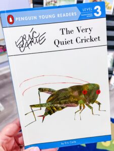 Cover of The Very Quiet Cricket by Eric Carle, featuring a green cricket against a white background in Carle’s signature collage style.