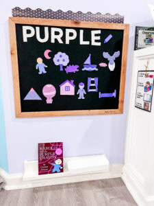 Black felt board with purple felt pieces; Harold and the Purple Crayon book displayed below.
