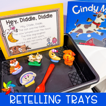 Hey Diddle Diddle preschool nursery rhyme retelling tray with character figurines, a printed rhyme card, and a related book.