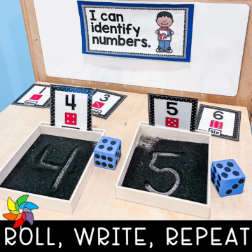 Preschool math center with dice and sand writing trays.