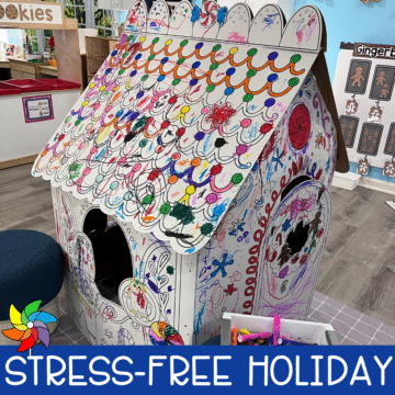 Colorful cardboard gingerbread house decorated by preschoolers during a holiday classroom activity.